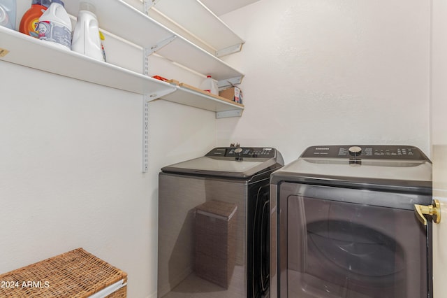 laundry room featuring washing machine and clothes dryer