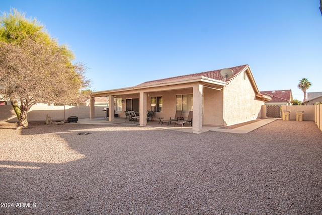 back of house featuring a patio