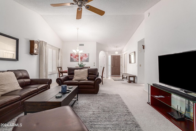 carpeted living room with ceiling fan with notable chandelier, a textured ceiling, and high vaulted ceiling