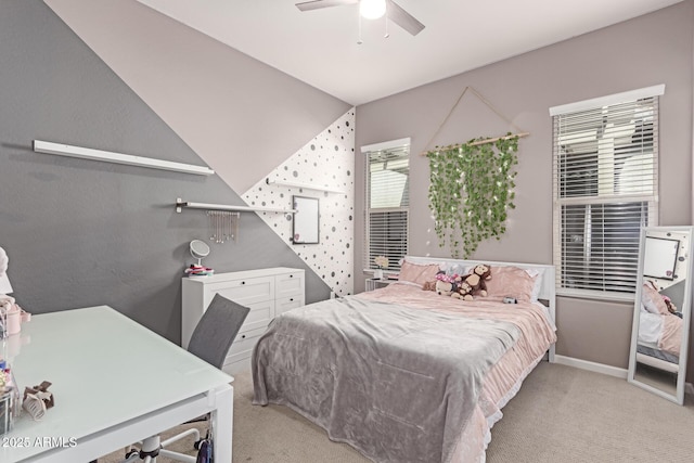 bedroom featuring light carpet, baseboards, and a ceiling fan