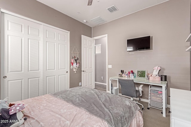 bedroom with light carpet, baseboards, visible vents, a ceiling fan, and a closet