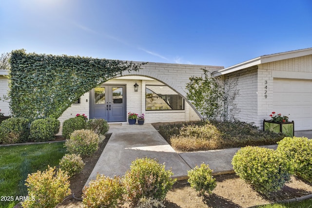 doorway to property featuring a garage