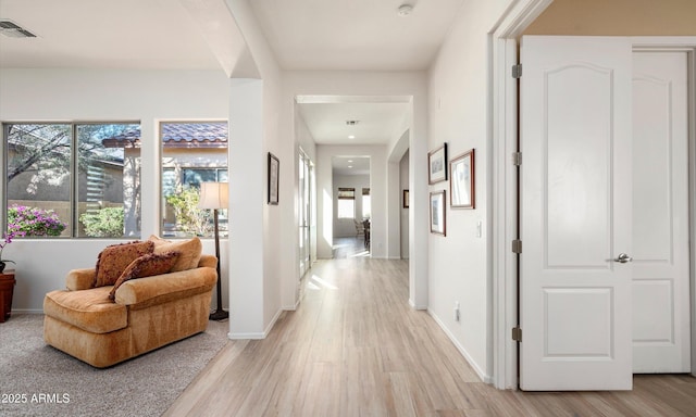 hallway featuring light hardwood / wood-style flooring