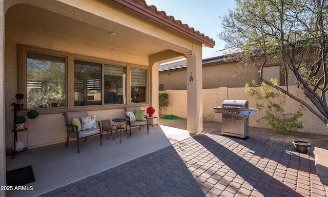 view of patio with a grill