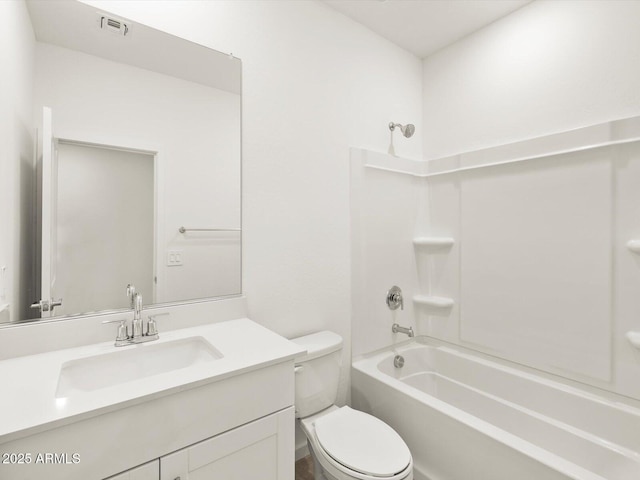 bathroom featuring visible vents, vanity, toilet, and bathing tub / shower combination