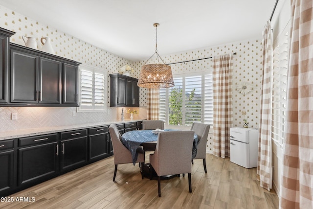 14204 S 179th Ln, Goodyear, AZ 85338 - dining area with a wealth of natural light, light wood-style flooring, and wallpapered walls