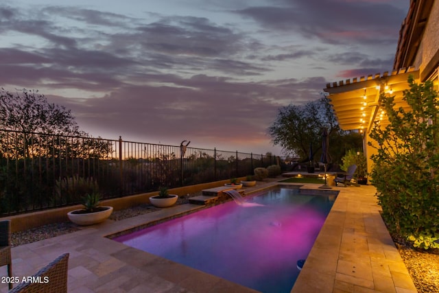 14204 S 179th Ln, Goodyear, AZ 85338 - pool at dusk featuring a patio, a fenced backyard, and a fenced in pool