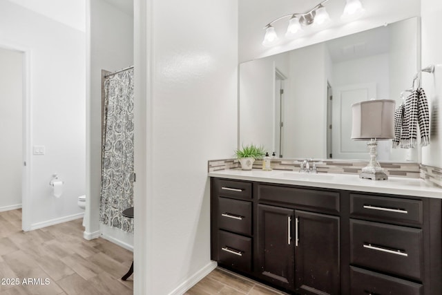 14204 S 179th Ln, Goodyear, AZ 85338 - full bath with toilet, a shower with shower curtain, vanity, and baseboards