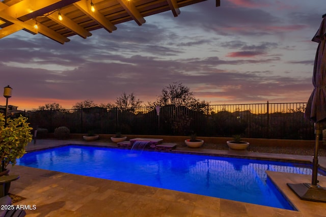 14204 S 179th Ln, Goodyear, AZ 85338 - pool at dusk with a fenced in pool, a patio, and fence