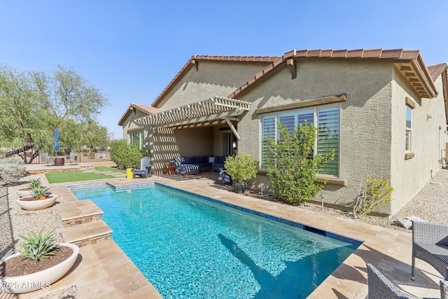 14204 S 179th Ln, Goodyear, AZ 85338 - back of property with a pergola, a patio, an outdoor hangout area, and stucco siding