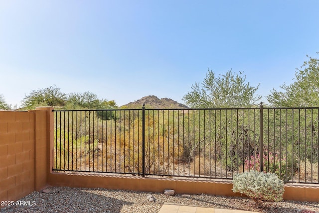 14204 S 179th Ln, Goodyear, AZ 85338 - view of gate featuring a mountain view and fence