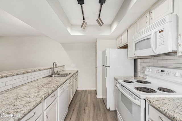 234 N 75th St Unit 209, Mesa, AZ 85207 - kitchen with white appliances, a sink, tasteful backsplash, white cabinetry, and a raised ceiling