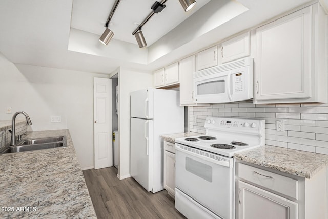 234 N 75th St Unit 209, Mesa, AZ 85207 - kitchen featuring white appliances, a sink, a raised ceiling, decorative backsplash, and dark wood-type flooring