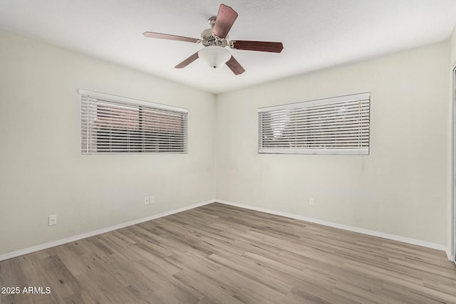 234 N 75th St Unit 209, Mesa, AZ 85207 - empty room featuring wood finished floors, baseboards, and a ceiling fan