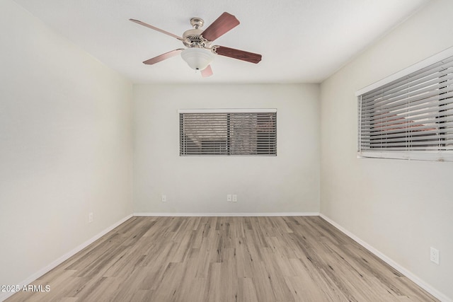 234 N 75th St Unit 209, Mesa, AZ 85207 - unfurnished room with wood finished floors, a ceiling fan, and baseboards