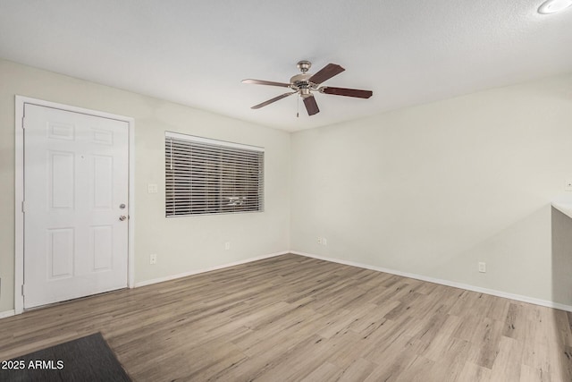 234 N 75th St Unit 209, Mesa, AZ 85207 - unfurnished living room featuring wood finished floors, ceiling fan, and baseboards