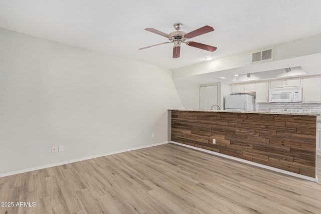 234 N 75th St Unit 209, Mesa, AZ 85207 - unfurnished living room with a ceiling fan, light wood-type flooring, and baseboards