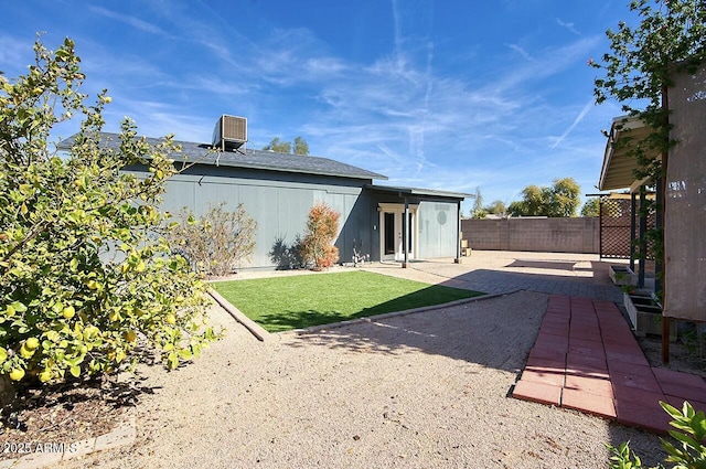 back of house with a patio and central AC unit