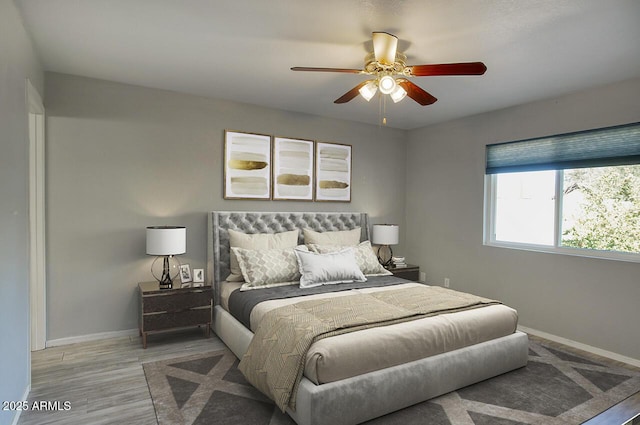 bedroom featuring ceiling fan and light hardwood / wood-style floors