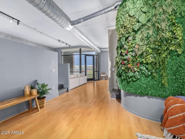 hallway featuring hardwood / wood-style flooring