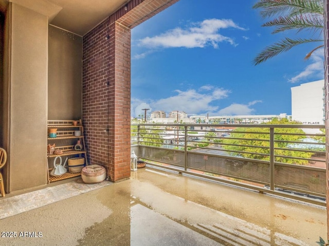 view of patio featuring a balcony