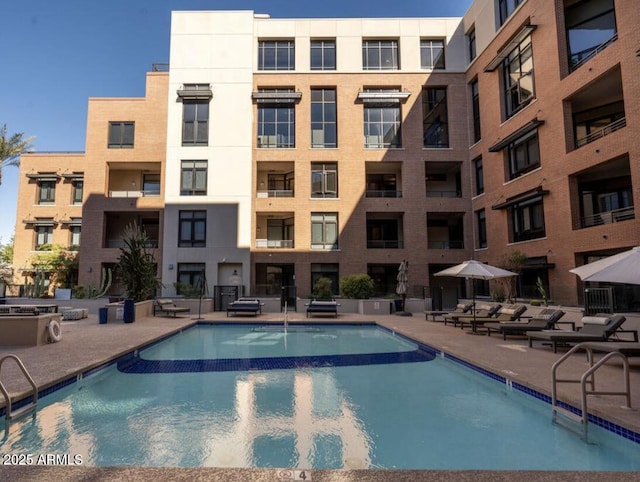 view of pool featuring a patio