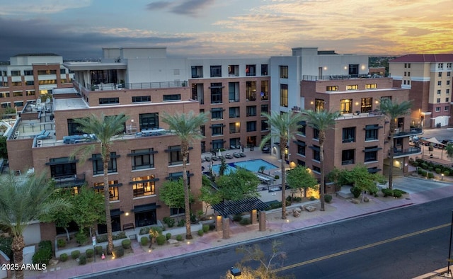 view of outdoor building at dusk