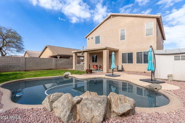 view of swimming pool with a patio area