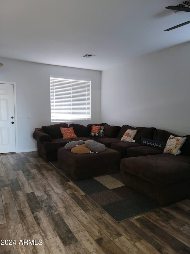 living room with dark hardwood / wood-style flooring