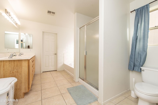 full bathroom featuring vanity, tile patterned floors, independent shower and bath, and toilet