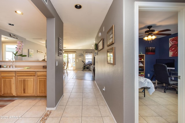 hall featuring light tile patterned flooring