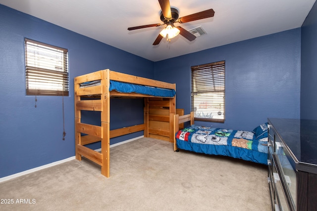 carpeted bedroom with ceiling fan