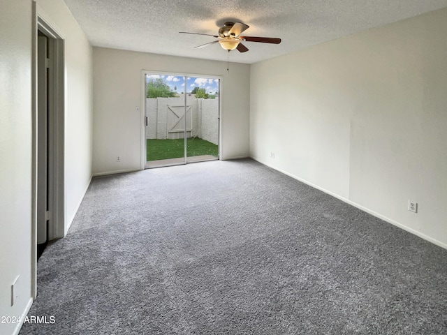 carpeted empty room featuring a ceiling fan, a textured ceiling, and baseboards