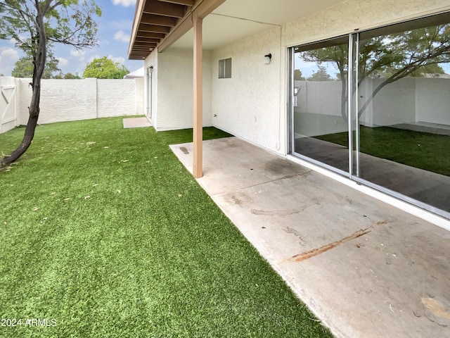 view of yard with a fenced backyard and a patio