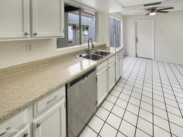 kitchen with light tile patterned floors, white cabinets, dishwasher, ceiling fan, and a sink