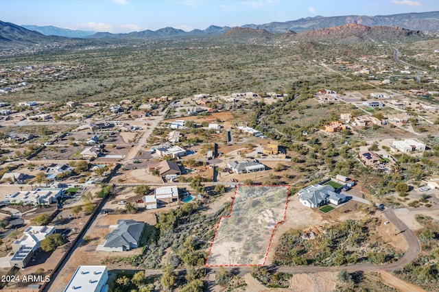 birds eye view of property featuring a mountain view