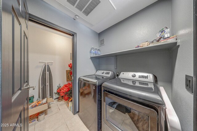 5303 N 7th St Unit 331, Phoenix, AZ 85014 - laundry room featuring washer and clothes dryer and light tile patterned flooring