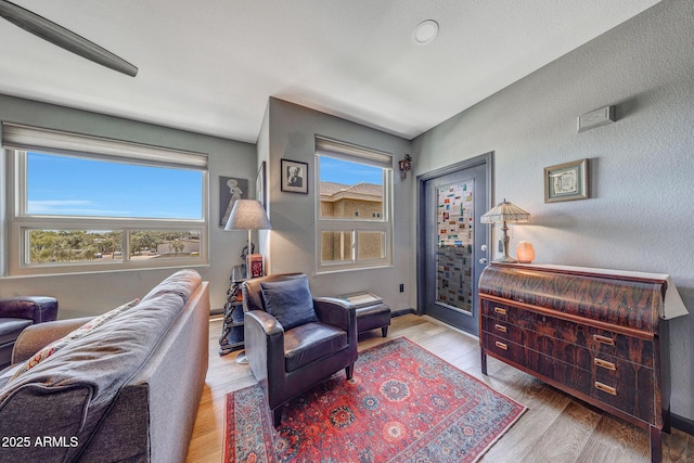5303 N 7th St Unit 331, Phoenix, AZ 85014 - sitting room with wood finished floors and baseboards