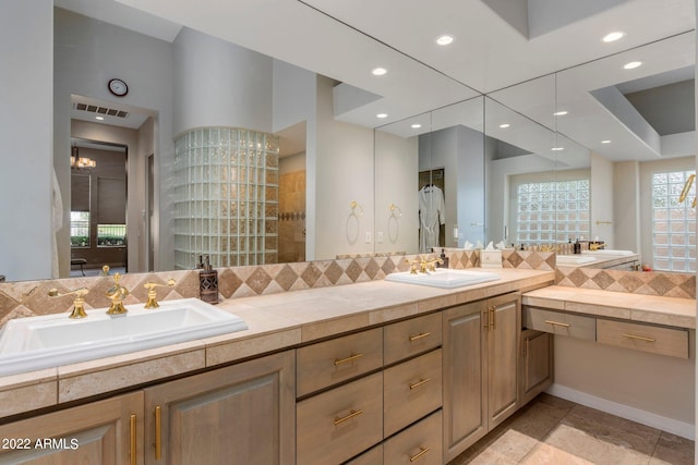 bathroom with tile floors and double sink vanity