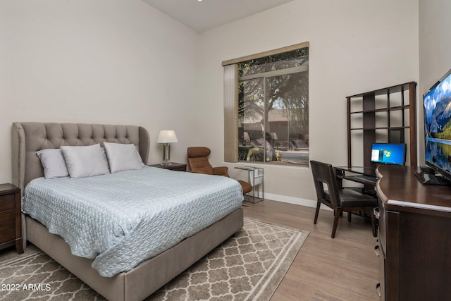 bedroom with hardwood / wood-style flooring