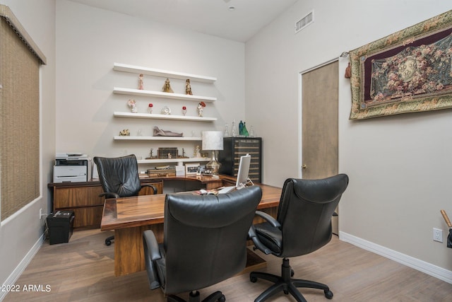 office space with hardwood / wood-style floors