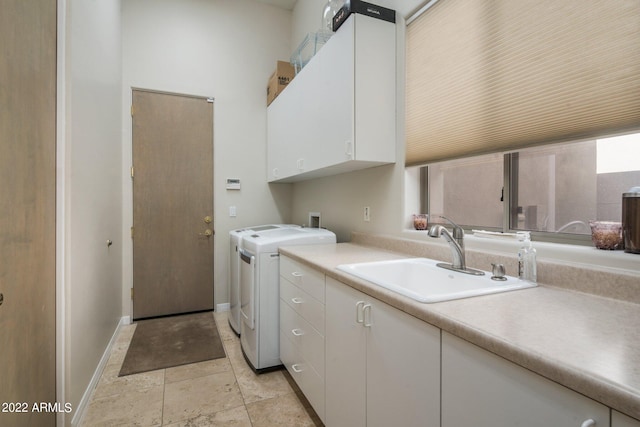 laundry room featuring light tile floors, cabinets, hookup for a washing machine, independent washer and dryer, and sink