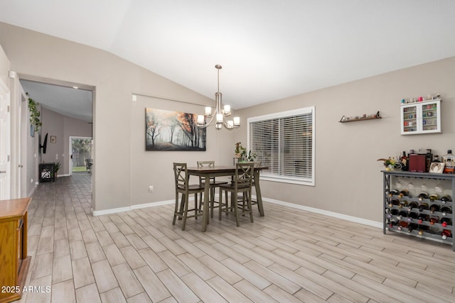 1583 N Constellation Ct, Gilbert, AZ 85234 - dining area with vaulted ceiling, a chandelier, and light wood-style flooring