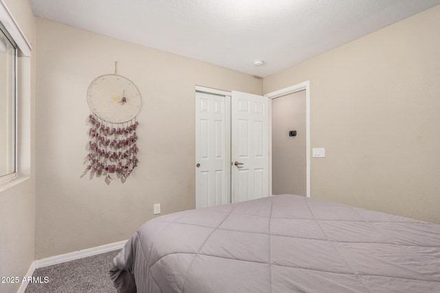 1583 N Constellation Ct, Gilbert, AZ 85234 - carpeted bedroom with baseboards and a closet