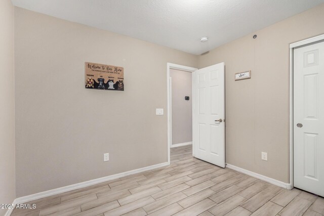1583 N Constellation Ct, Gilbert, AZ 85234 - unfurnished bedroom with light wood-type flooring and baseboards