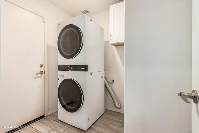1583 N Constellation Ct, Gilbert, AZ 85234 - laundry area with stacked washing machine and dryer and cabinet space