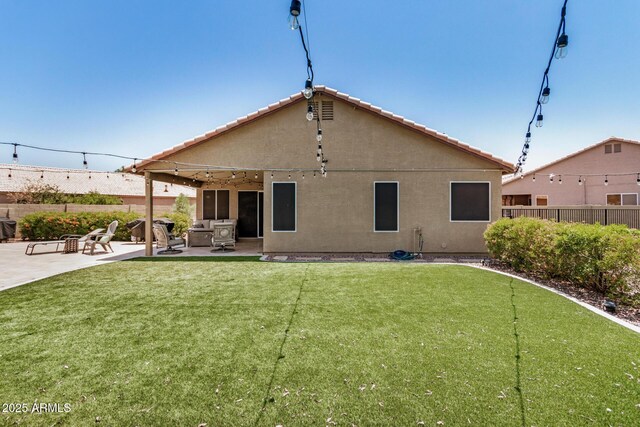 1583 N Constellation Ct, Gilbert, AZ 85234 - back of house featuring a fenced backyard, a patio area, stucco siding, and a putting area
