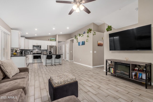 1583 N Constellation Ct, Gilbert, AZ 85234 - living room with lofted ceiling, ceiling fan, light wood-type flooring, and recessed lighting