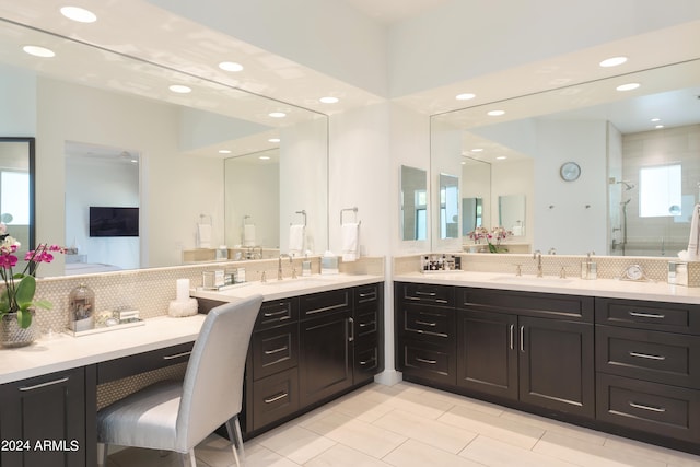 bathroom with tasteful backsplash, tile flooring, and large vanity