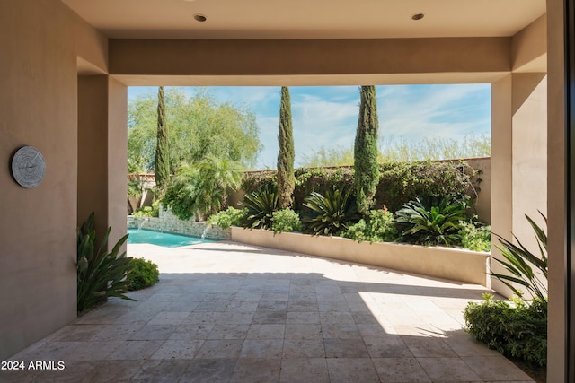 view of patio with pool water feature